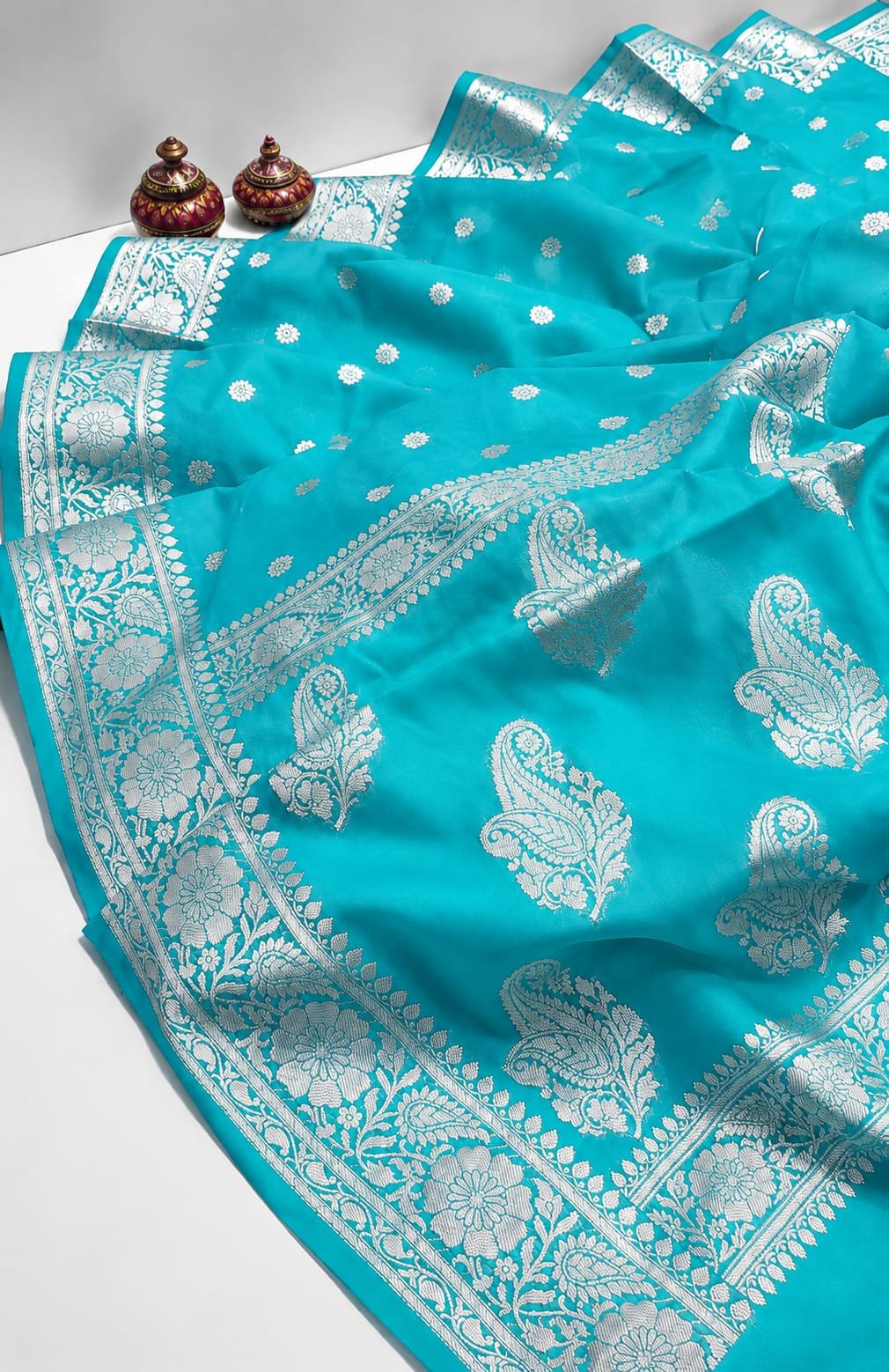 Enchanting Firozi Blue Katan Silk Banarasi Saree with Silver Zari Paisley Motifs